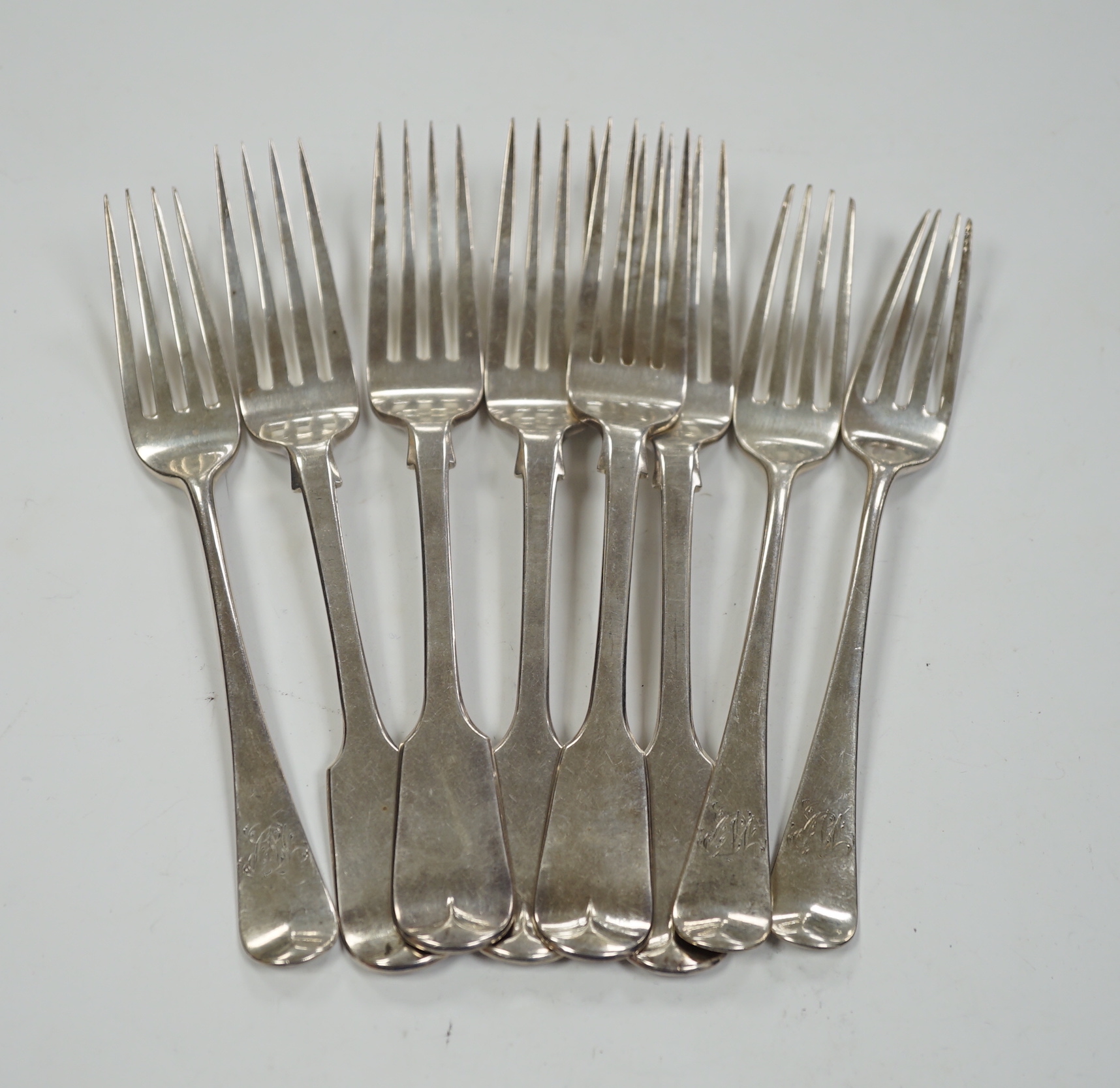 Five Victorian silver fiddle pattern dessert forks, London, 1854 and three George III silver dessert forks, 10.9oz.